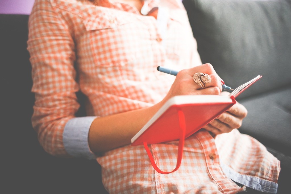 cheery girl with journal